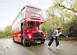 Manjit Singh pulls bus with ears.jpg