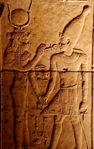 3806136-philae-mother-god-isis-offering-key-of-life-ankh-to-her-son-horus-0.jpg